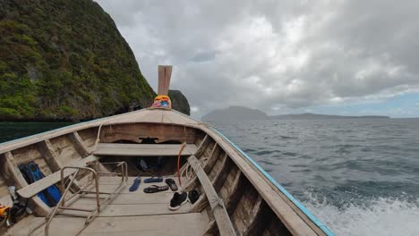 the bow of a longtail boat navigating to koh phi phi leh islands in krabi, thailand