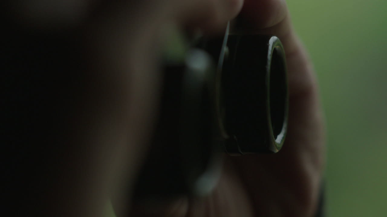 Person taking a photo with a vintage camera