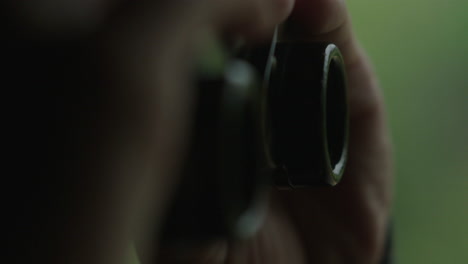 Person taking a photo with a vintage camera