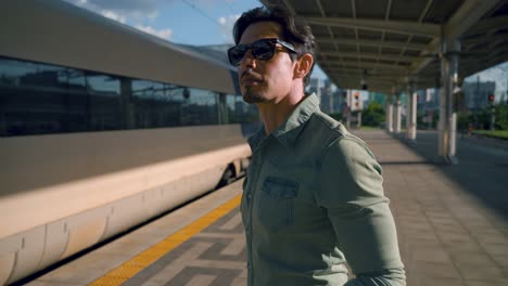 Man Waiting at Train Station Platform
