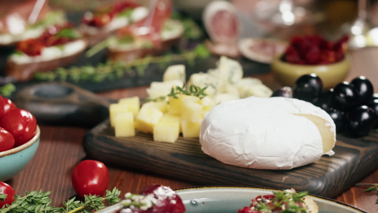 Cheese platter with olives and tomatoes