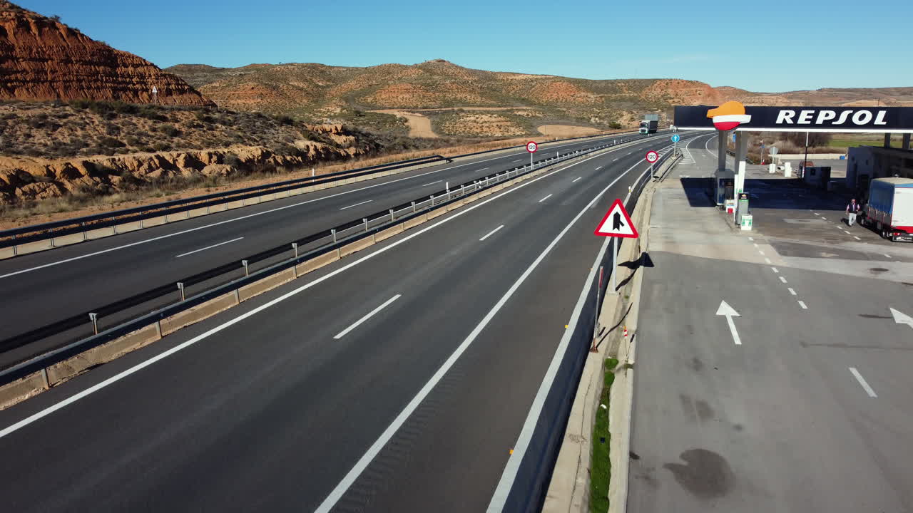 Highway with Gas Station and Scenic Landscape