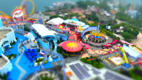 tilt-shift timelapse of ocean park theme park in hong kong on a sunny day, wide angle drone shot