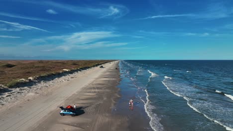 idyllic scenery of the beach with people on the shore in padre island, texas, usa - aerial drone shot