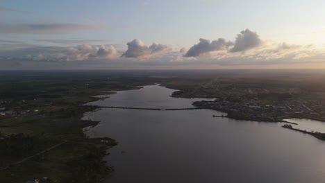 aerial view of a lake and village at sunset