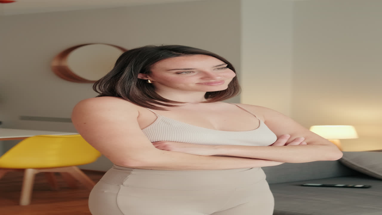 Portrait of Happy Woman Smiling at Home with Crossed Arms