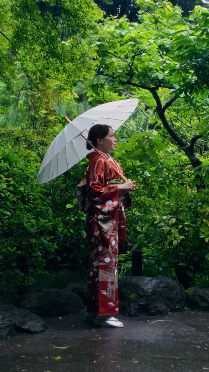 Japanese Woman in Kimono in a Garden