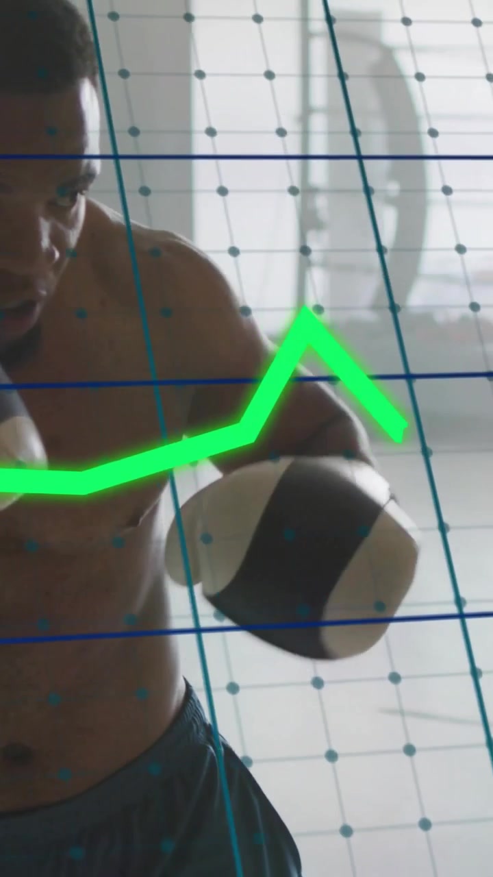 Vertical video: Boxer training with jabs and crosses, data grid showing green peaks over punches