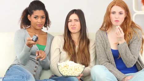 three friends watching television