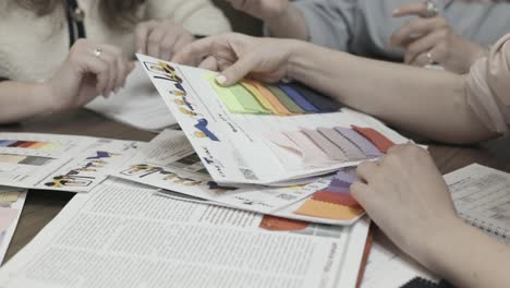 fashion designers reviewing fabric swatches