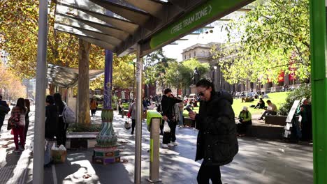 people walking and interacting near library entrance