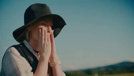 thoughtful woman wearing hat against sky