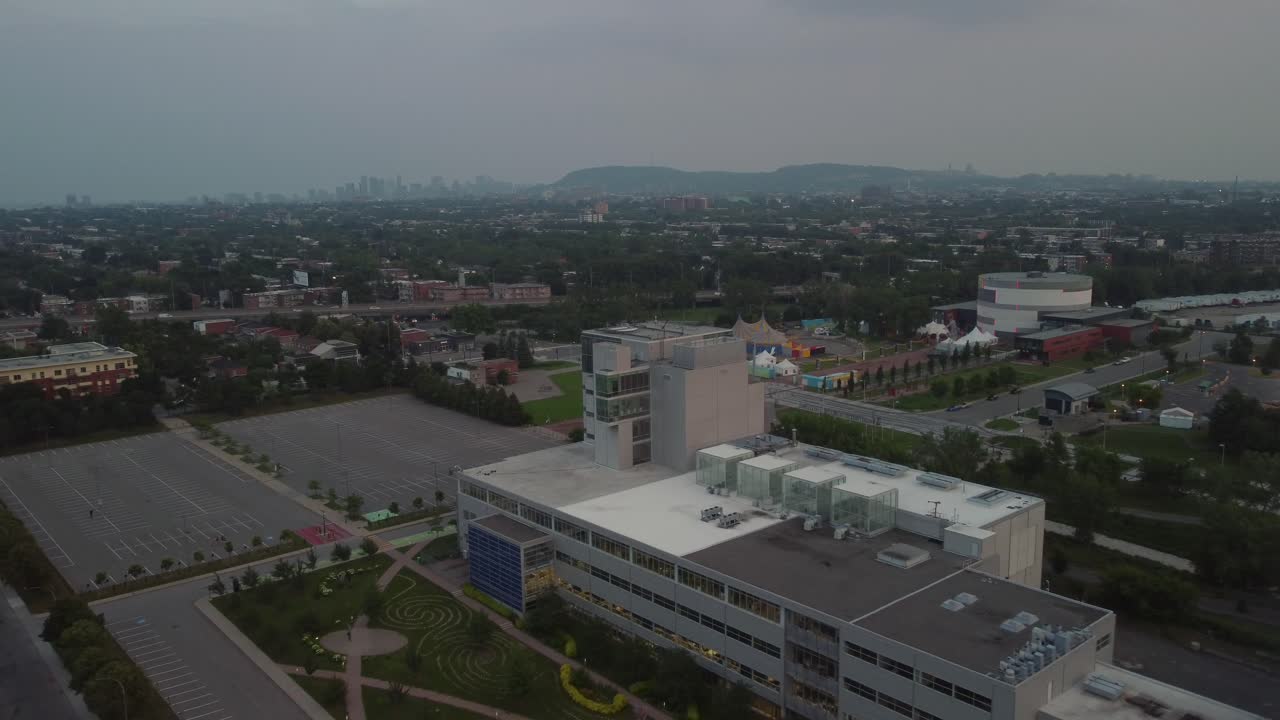 City building fly away with Montreal Mont Royal skyline in distance