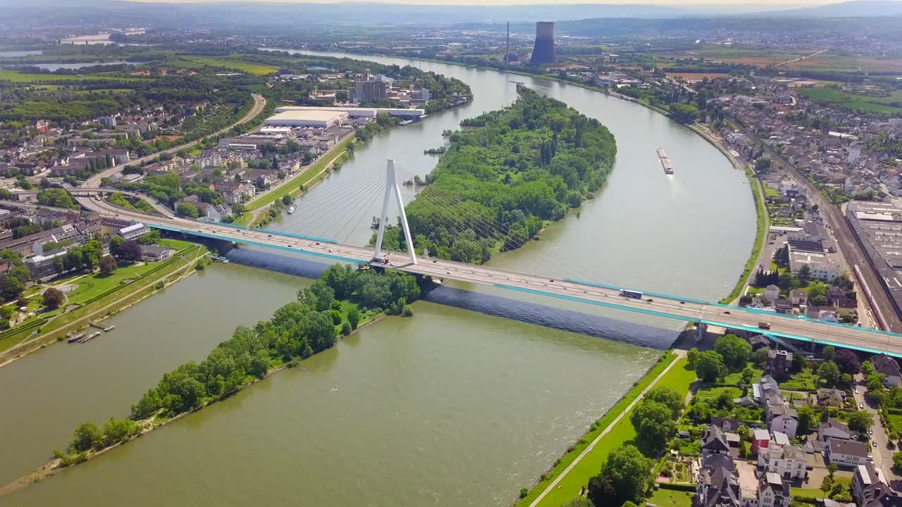 High view point of the Rhine bridge in Neuwied, Germany, showcasing a vital transport route with traffic moving steadily across, emphasizing the region's role in trade and logistics.