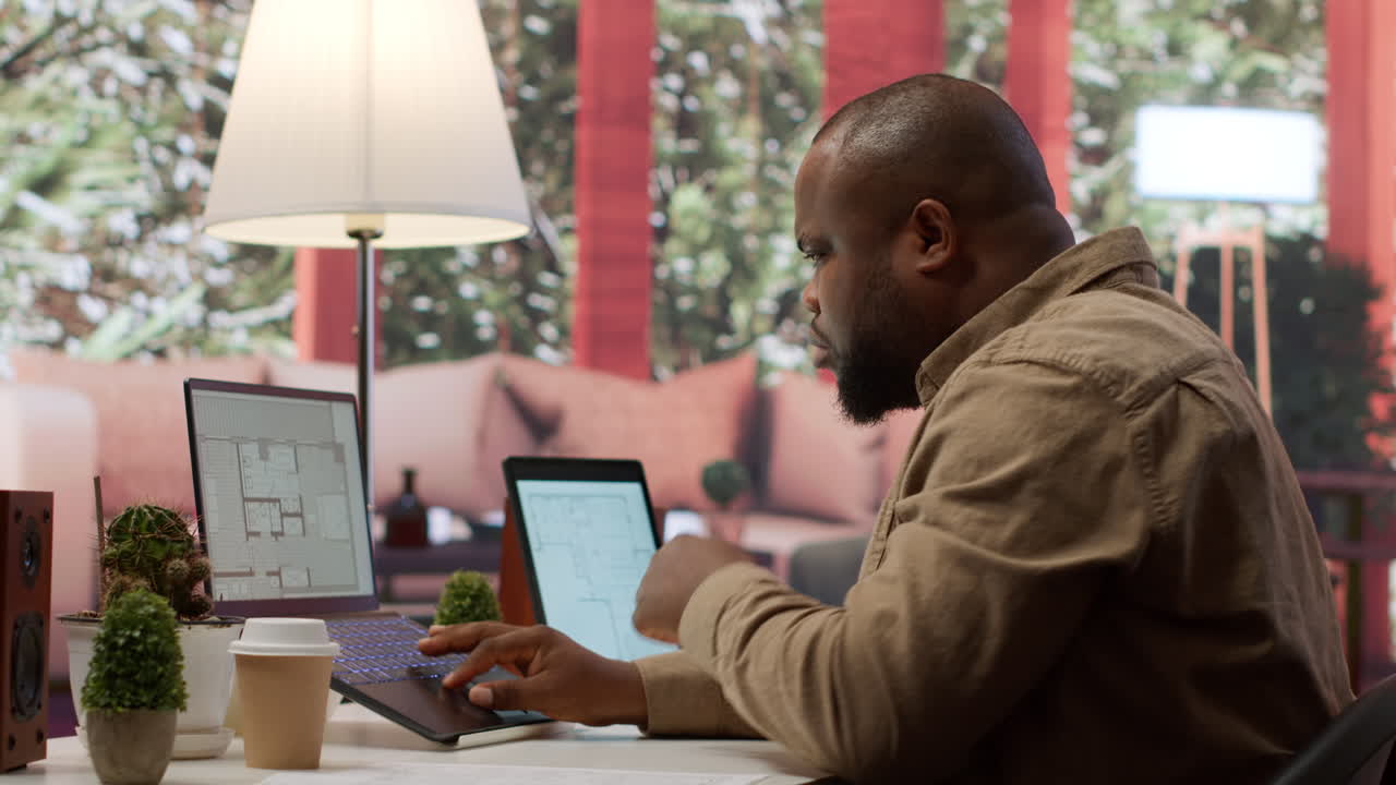 Businessman evaluating architectural blueprints for a modern office space