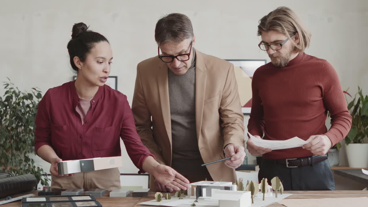 Team Of Architects Working With 3D House Layout