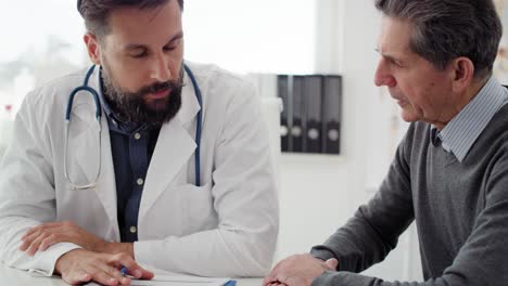 Handheld-view-of-doctor-and-patient-discussing-some-medical-records