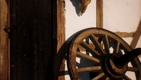 old-wood-wheel-and-black-door-at-white-house