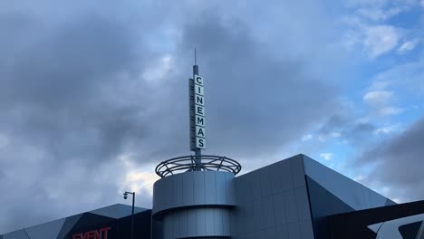 timelapse of cinemas sign with cloud moving