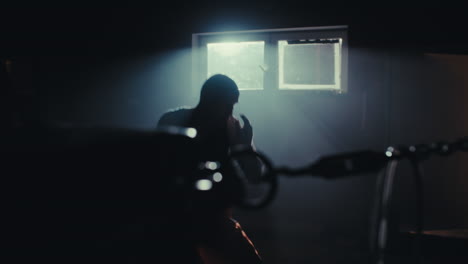 man boxing silhouette in dark gym