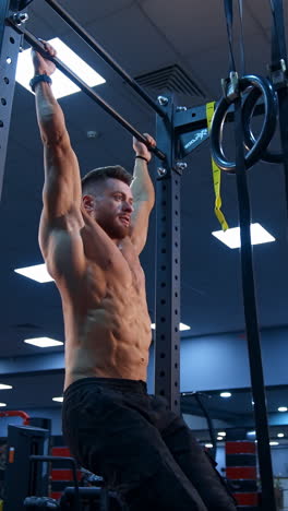 man performing hanging leg raises