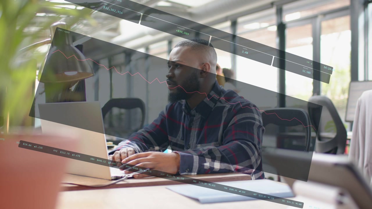 Typing plaid man checking laptop in office overlay appearing while coworker talking on phone