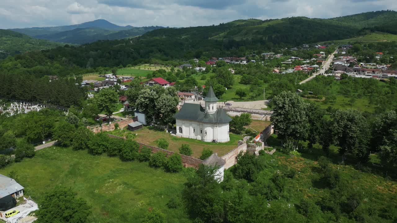 Fly Away At The Mera Orthodox Monastery In Vrancea, Romania. Aerial Pullback Shot
