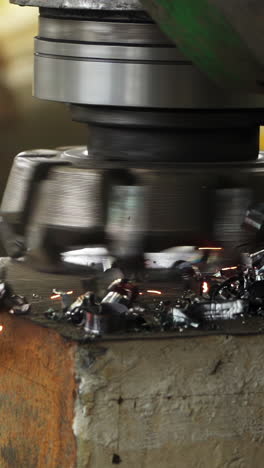metalworking process with machine producing sparks and shavings