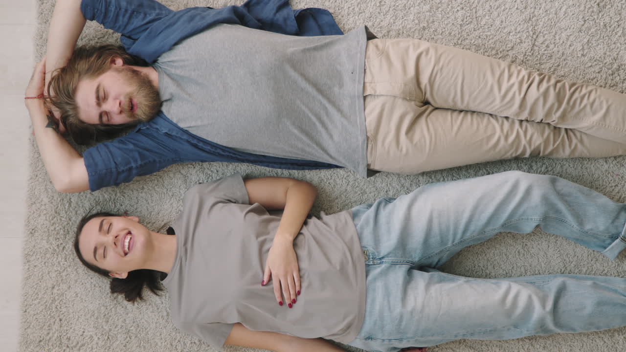 Couple Relaxing on Carpet