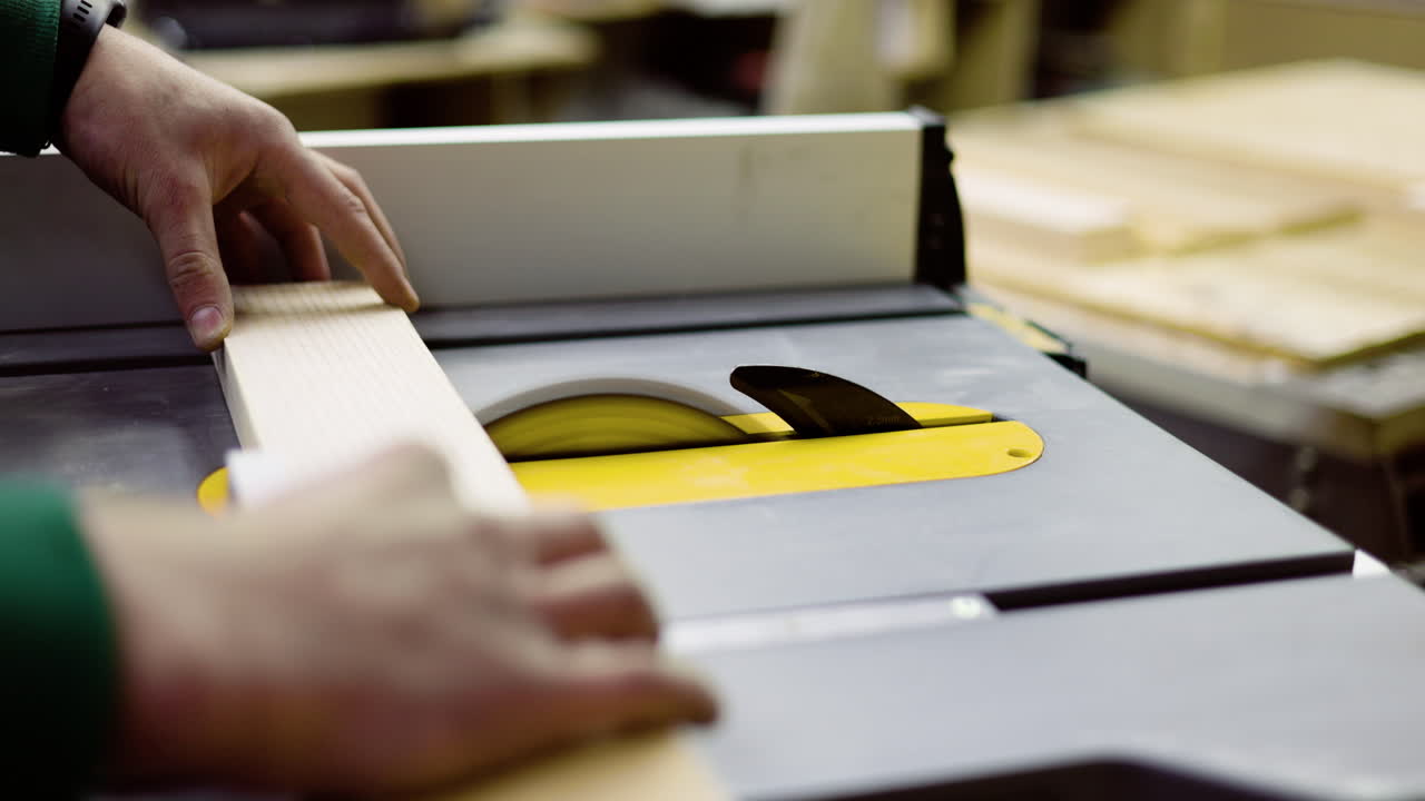 Worker using power saw