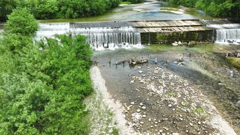 savinja waterfall river aerial drone panorama in logar valley lush natural park, forest and hills, slovenian landscape