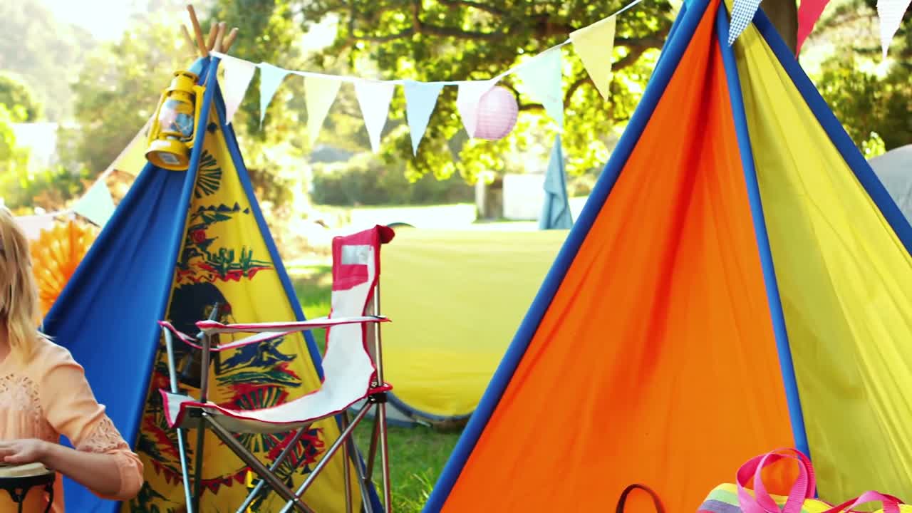 Woman playing bongo drum
