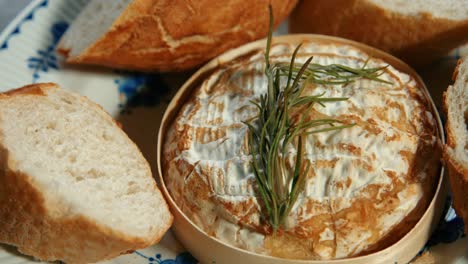 slow pan over baked french camembert with rosemary and baguette bread