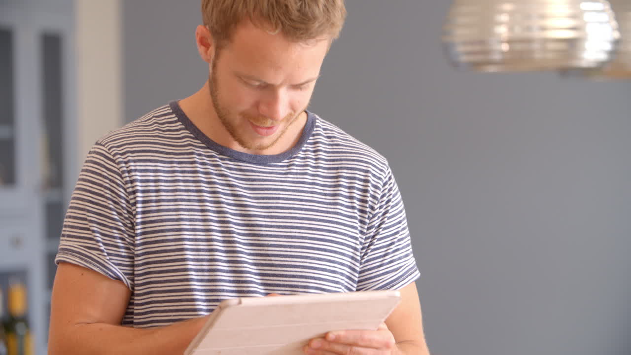 Man Follows Recipe On Digital Tablet In Kitchen Shot On R3D