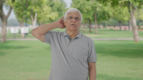 Tensed-Indian-old-man-sees-something-shocking-in-park