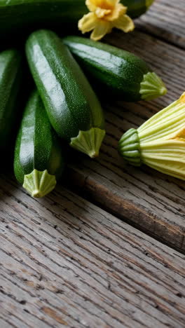fresh zucchini flower on a rustic wooden background