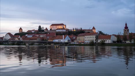 time lapse of a sunset over the city of ptuj with the river underneth in slovenia