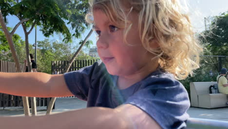 small girl spinning on roundabout