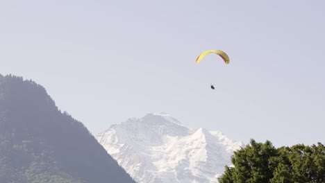 paraglider in front of a mountain