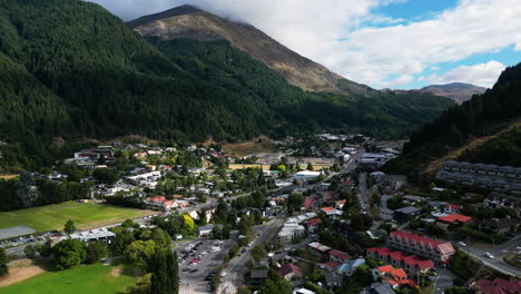 beautiful township of queenstown with streets and homes, aerial view