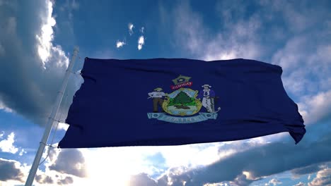 maine flag on a flagpole waving in the wind in the sky. state of maine in the united states of america