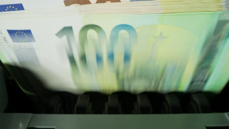 euro banknotes in a counting machine