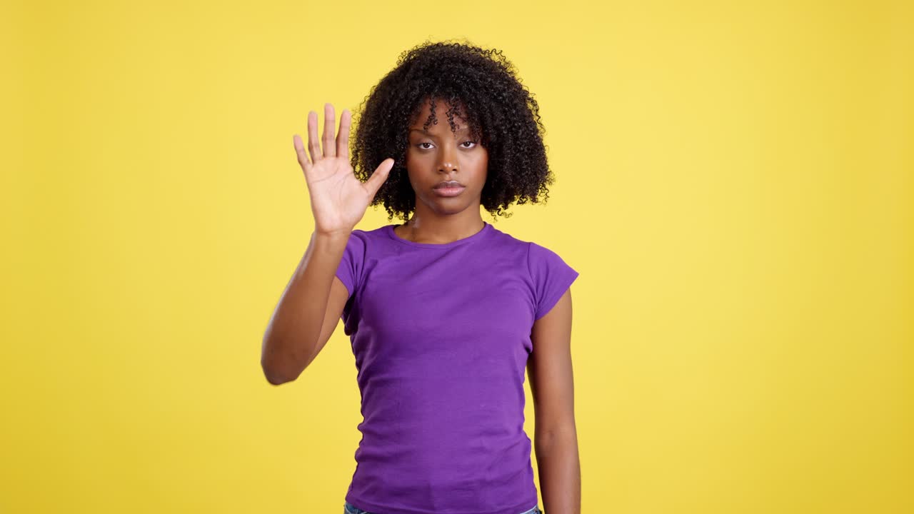 Young Woman Making Stop Gesture with Palm Extended