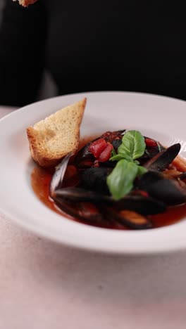 delicious mussels in tomato sauce with toasts