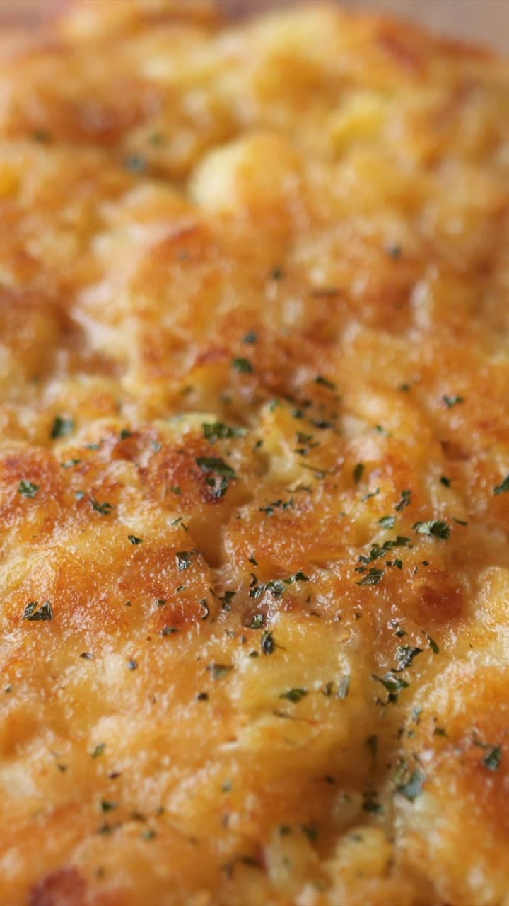 omlette top down pan, greasy dish typical for slovenia, made of cheese and potato, vertical