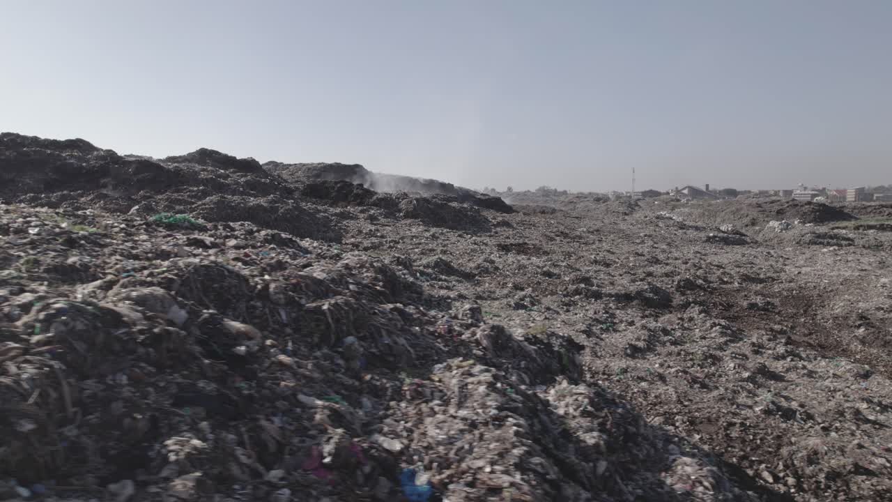 Dandora dumpsite in Nairobi Kenya Low camera close up angel of trash land fills