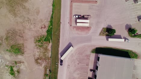 aerial view of trucks maneuvering at a logistics facility