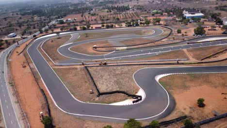 drone shot revealing kari motor speedway racetrack in chettipalayam, coimbatore, tamil nadu, india