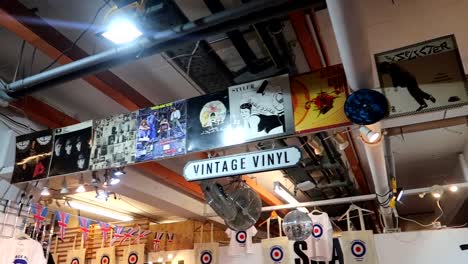 establisher interior pan showing vynil area in vintage market in brick lane, uk