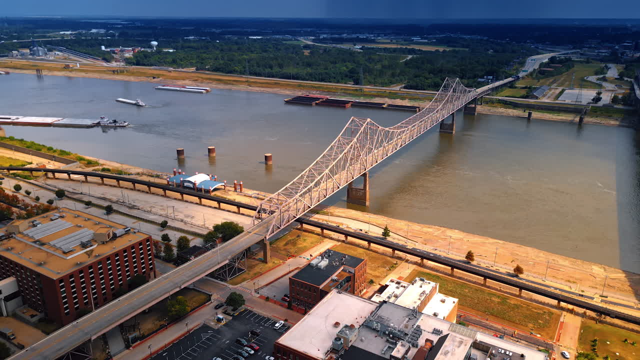 Rising over the waterfront of the Mississippi River in St. Louis, Missouri, USA. View on the Martin Luther Bridge and Eads Bridge across the river